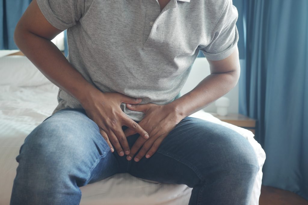 the concept of prostate and bladder problem, crotch pain of a young person
