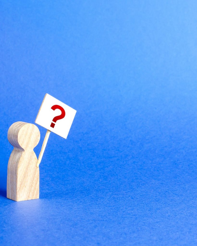 A person figurine with a question mark